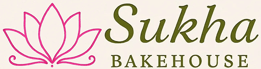 Sukha Bakehouse logo with pink lotus.